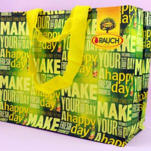 Lebensfreude seit 1919: RAUCH präsentiert die fröhliche 'Happy Day' Einkaufstasche.